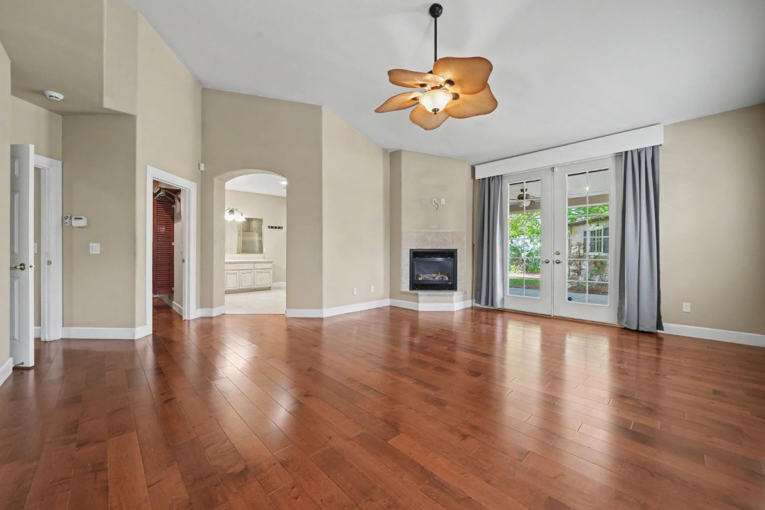 532 Oakridge Road Valley Springs, CA 95252 - Photo 47 of 89 a view of an empty room with wooden floor and a window