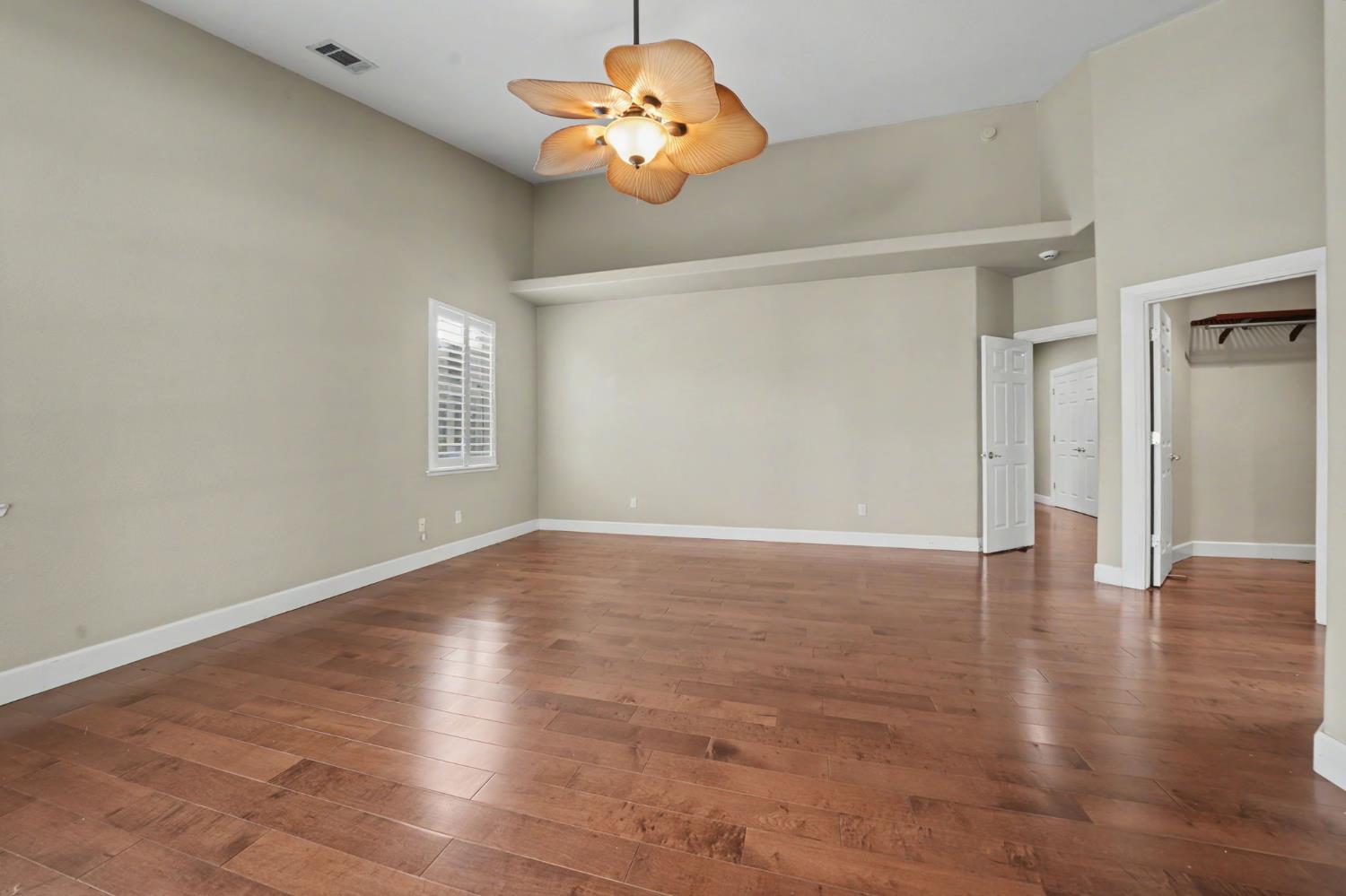 532 Oakridge Road Valley Springs, CA 95252 - Photo 51 of 89 a view of an empty room with a window and wooden floor
