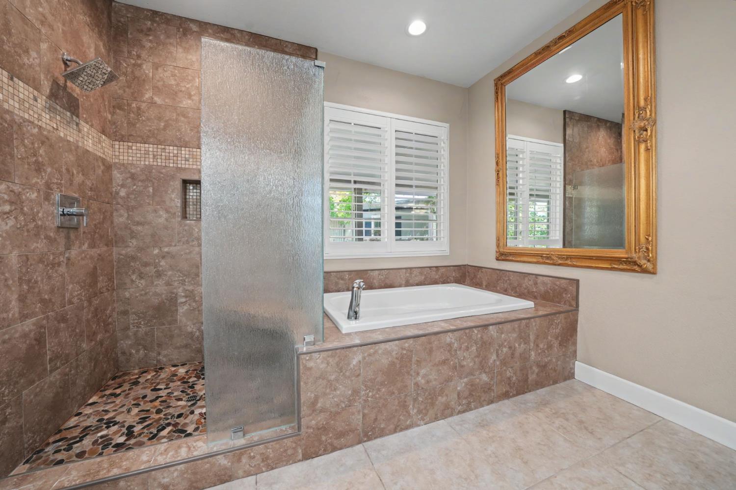 532 Oakridge Road Valley Springs, CA 95252 - Photo 54 of 89 a bathroom with a tub a sink and a window
