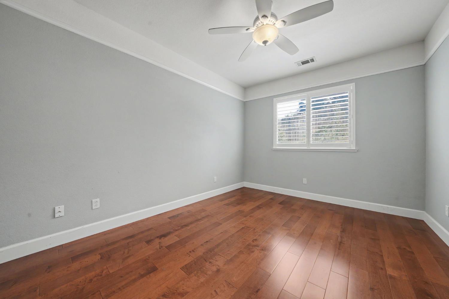 532 Oakridge Road Valley Springs, CA 95252 - Photo 56 of 89 an empty room with wooden floor and windows