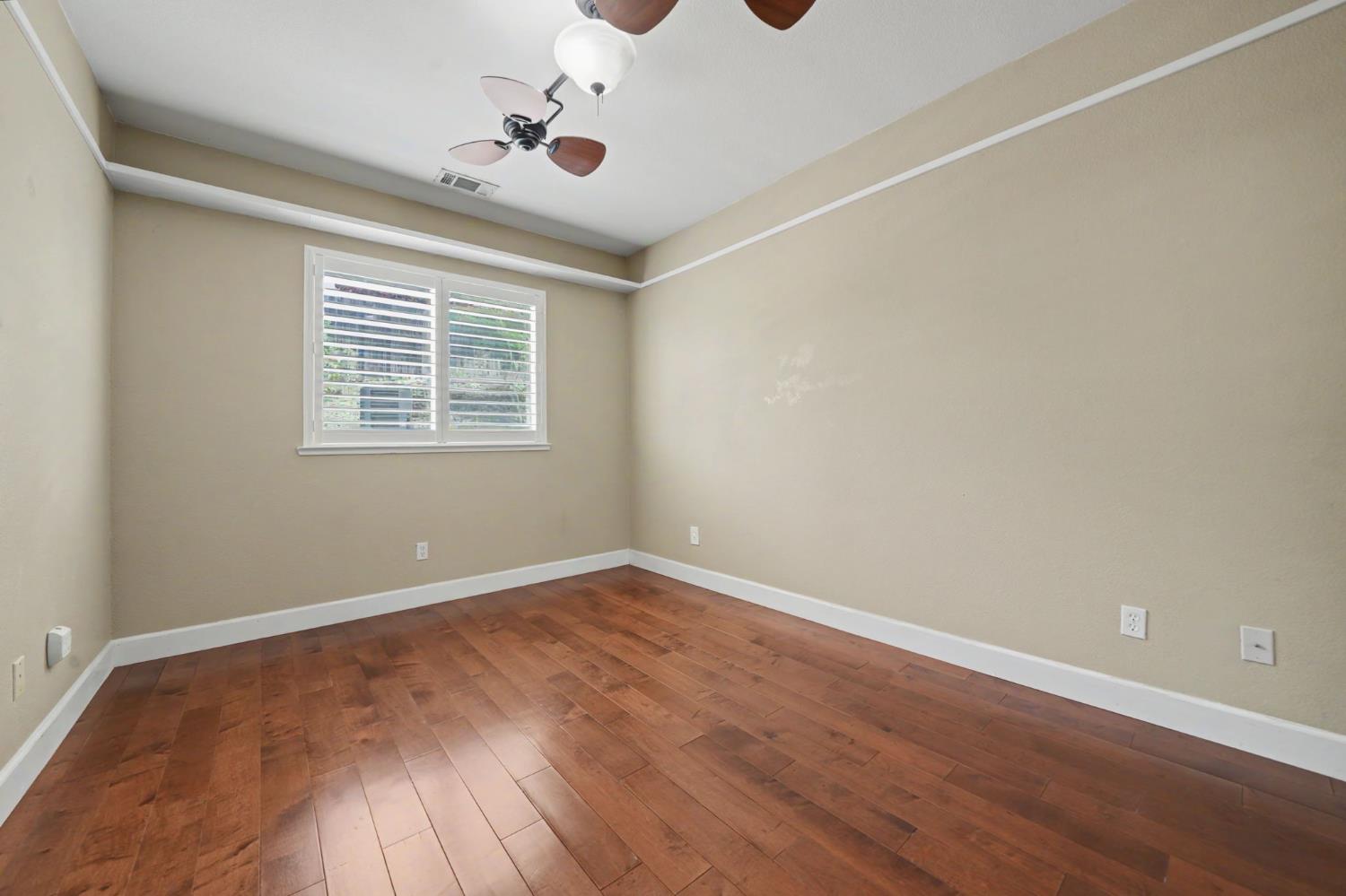 532 Oakridge Road Valley Springs, CA 95252 - Photo 59 of 89 an empty room with wooden floor and windows
