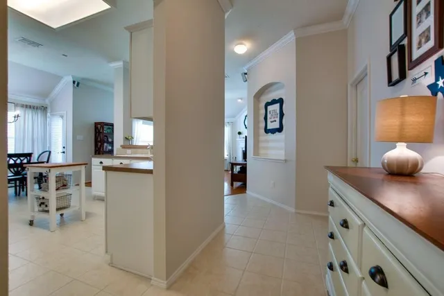 a room with a chandelier and a window