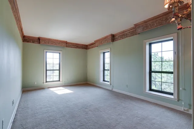 a view of a large body of water with a building in the background