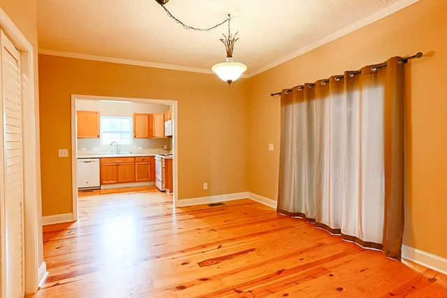 a view of a livingroom with wooden floor
