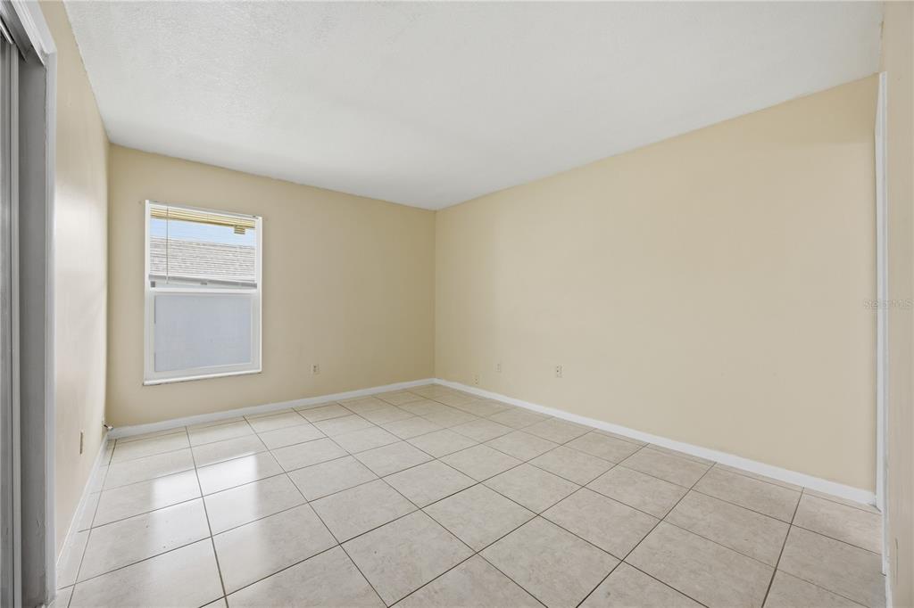 925 West Oak Ridge Road, Unit 925C Orlando, FL 32809 - Photo 10 of 15 a view of an empty room and window