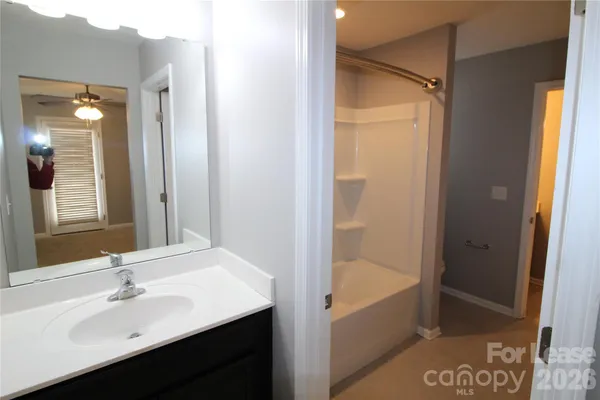 a bathroom with a bathtub and a sink