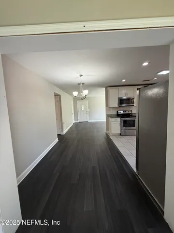 a view of a kitchen with a sink