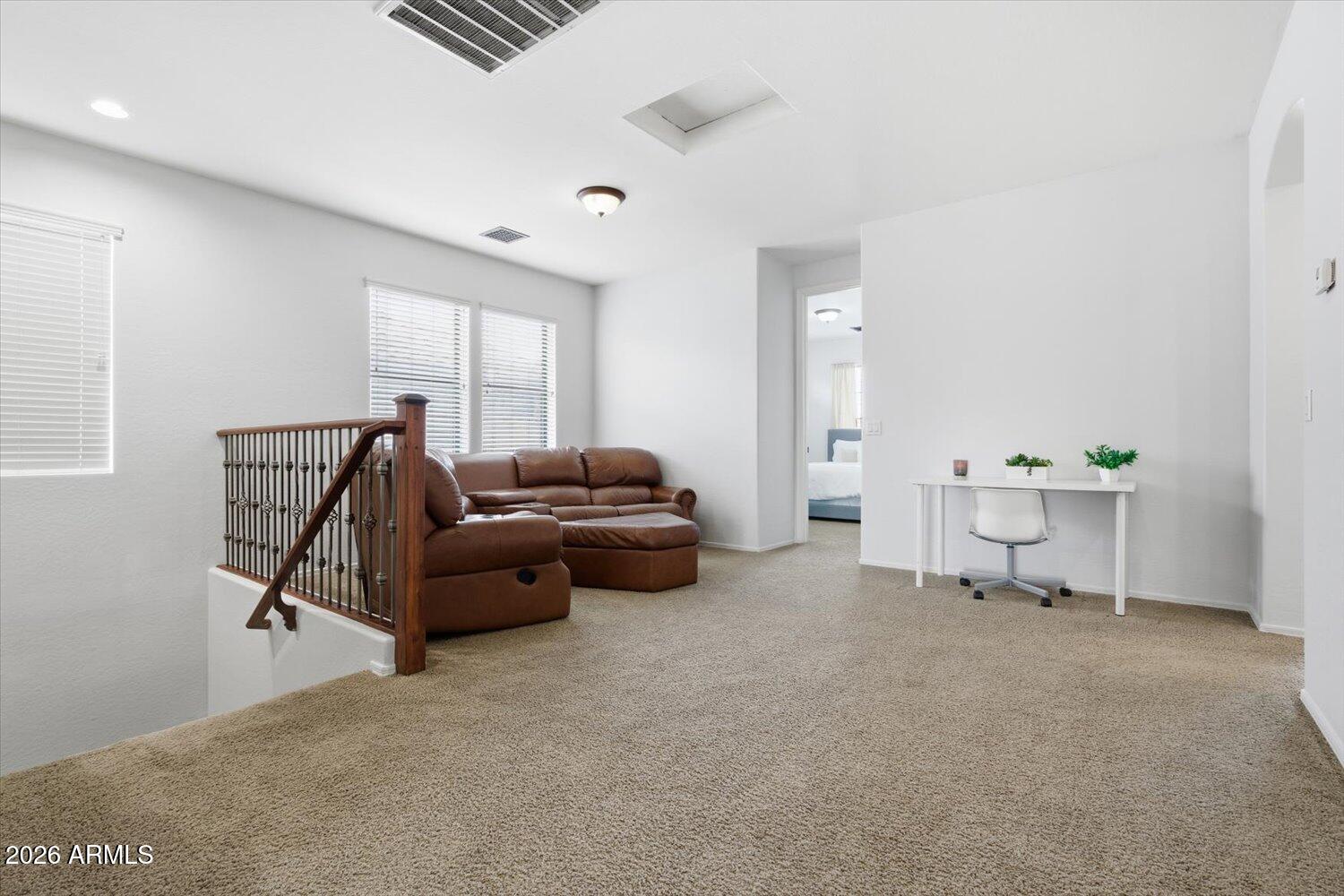 7253 East Nathan Street Mesa, AZ 85207 - Photo 12 of 34 a living room with furniture and a window