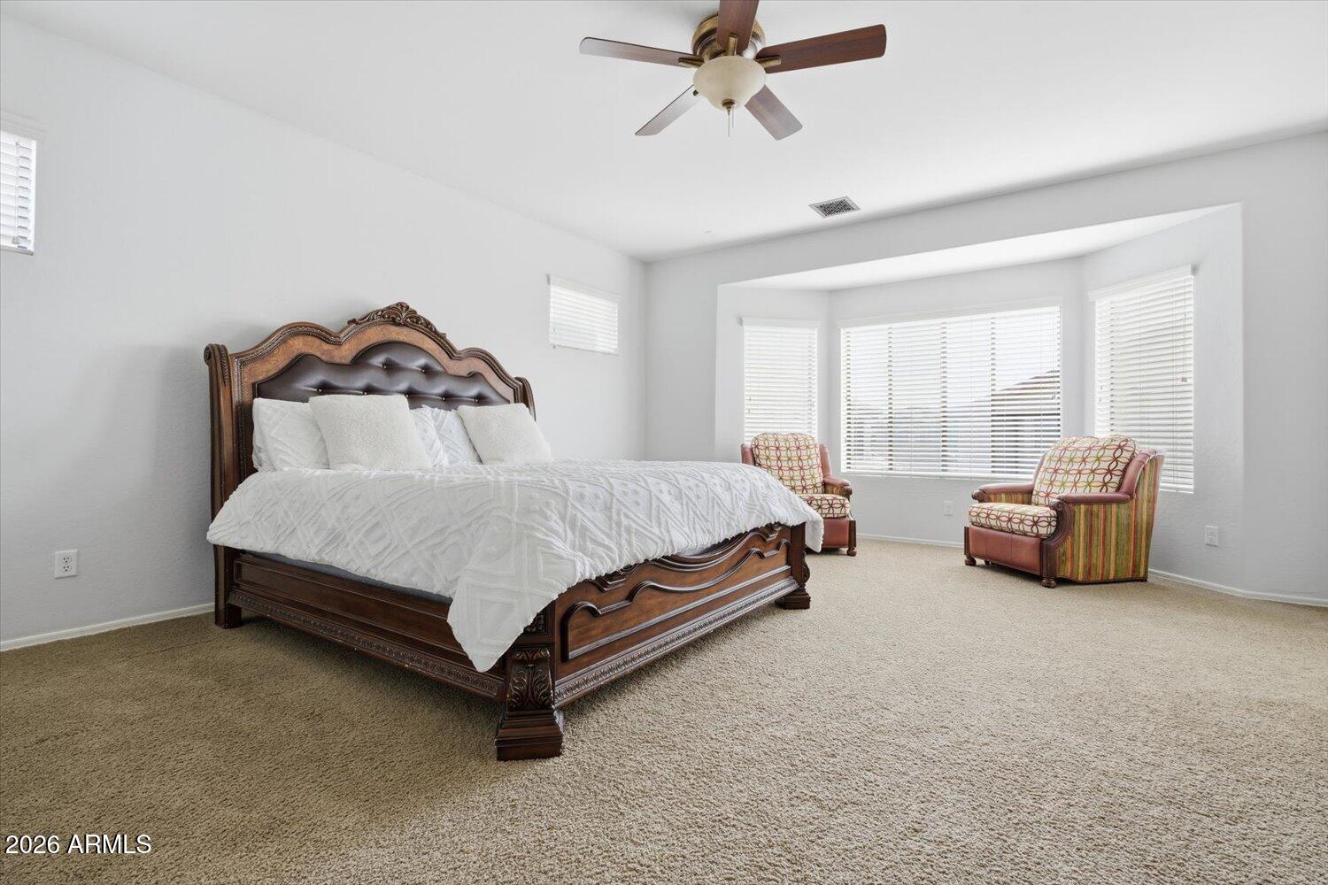 7253 East Nathan Street Mesa, AZ 85207 - Photo 14 of 34 a bedroom with furniture and a bed next to a window