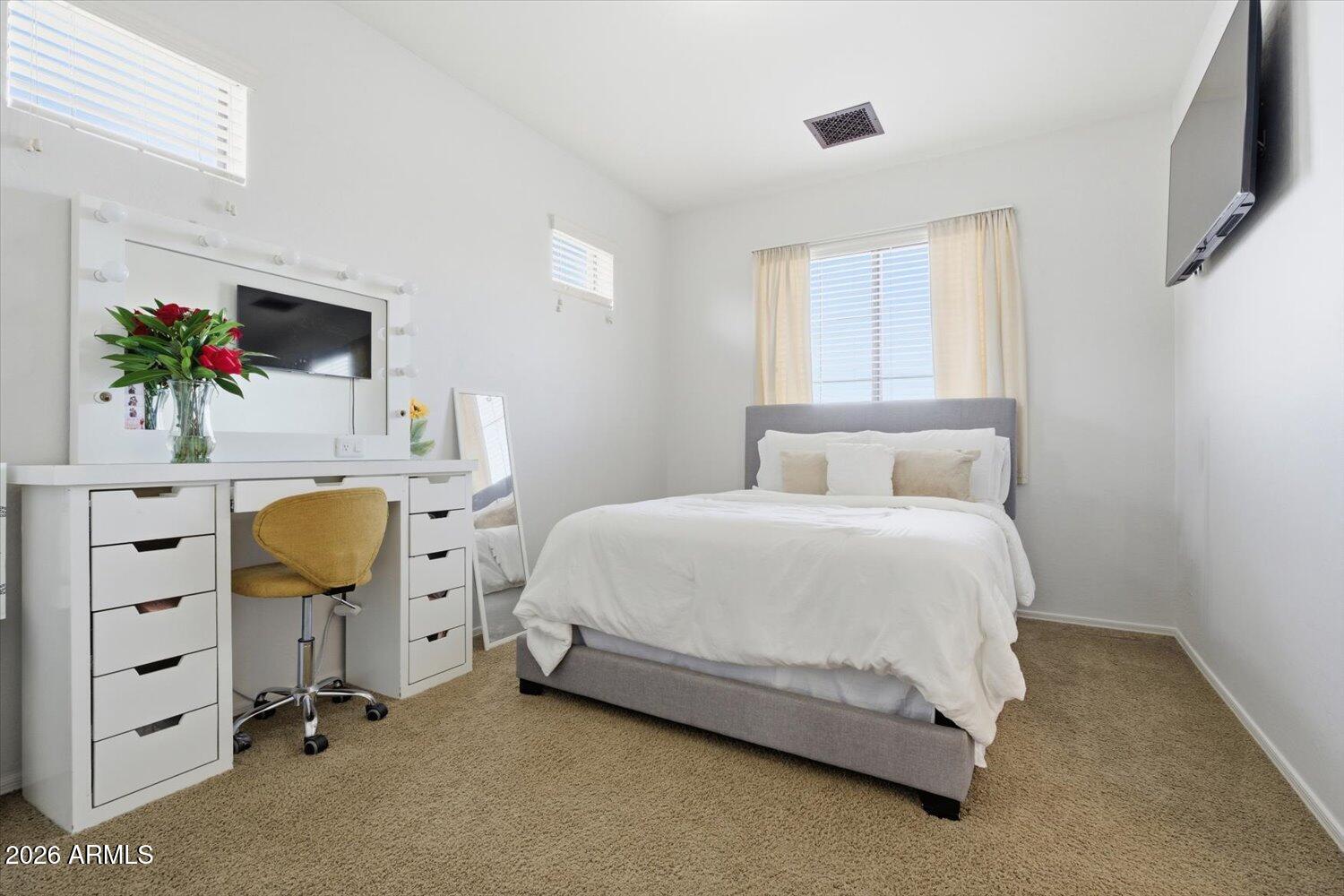 7253 East Nathan Street Mesa, AZ 85207 - Photo 17 of 34 a bedroom with a bed chair and dresser
