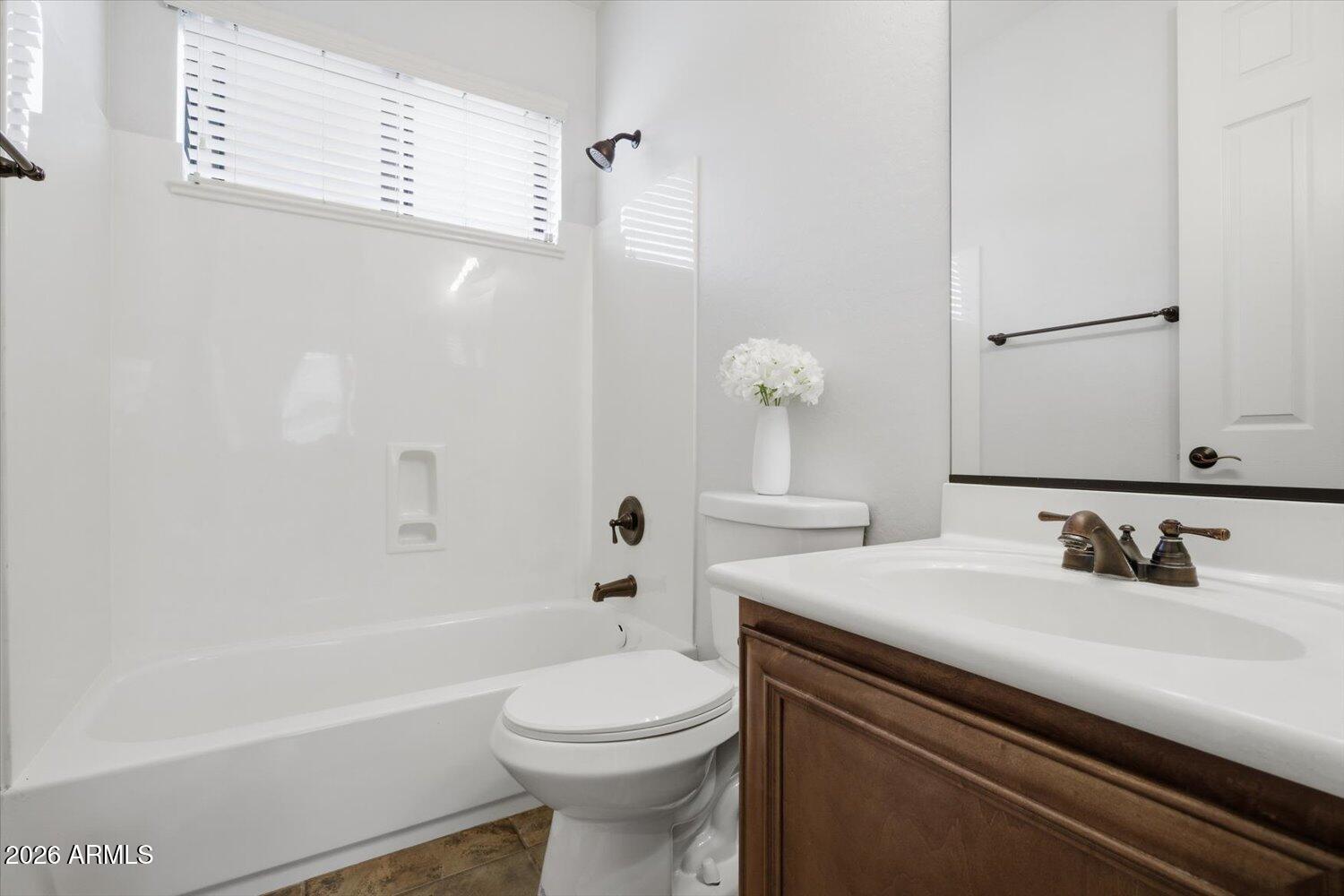 7253 East Nathan Street Mesa, AZ 85207 - Photo 20 of 34 a bathroom with a sink a toilet and shower