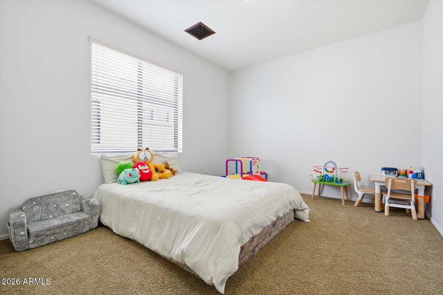 7253 East Nathan Street Mesa, AZ 85207 - Photo 21 of 34 a bedroom with a bed and a window