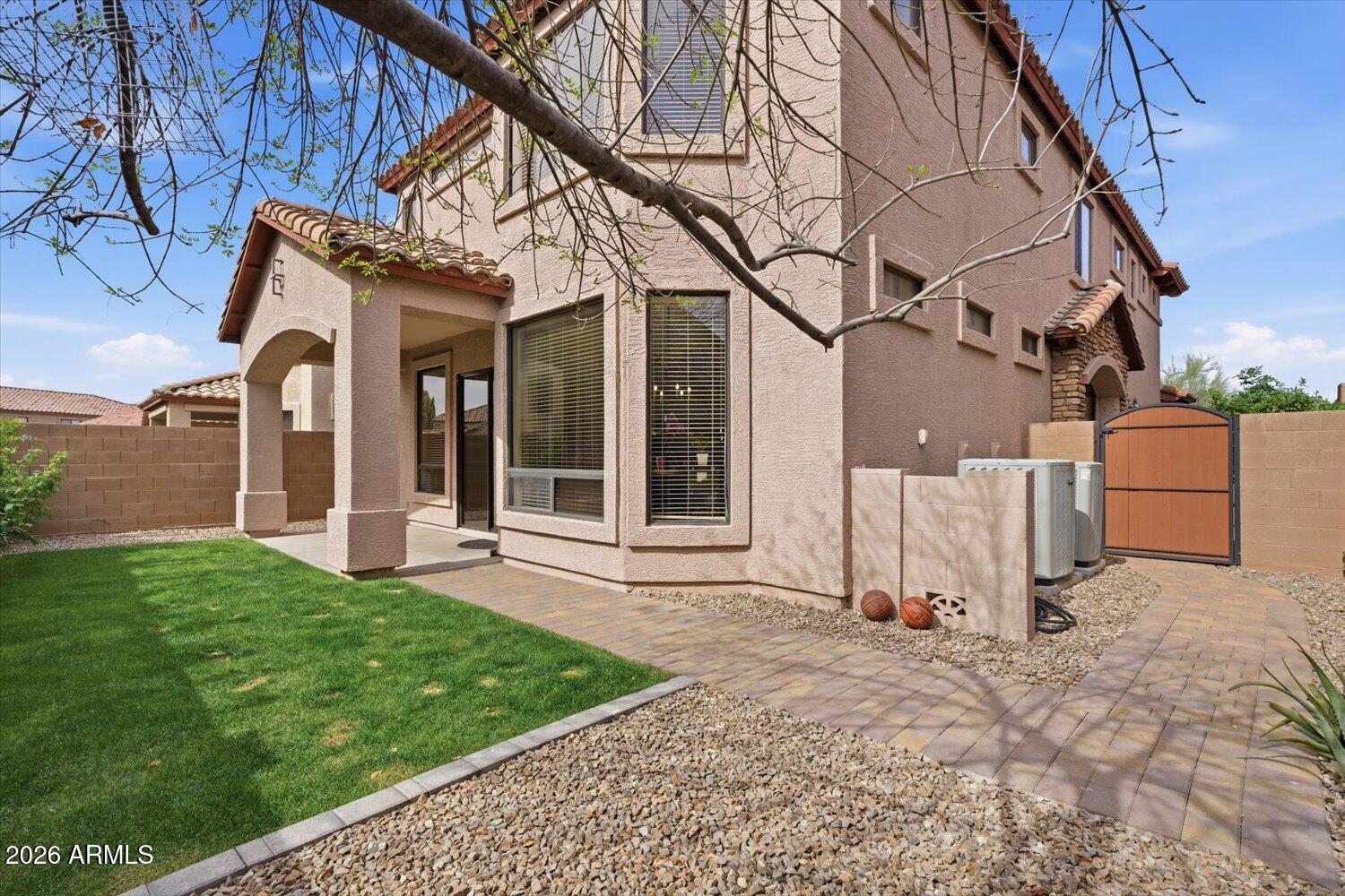 7253 East Nathan Street Mesa, AZ 85207 - Photo 25 of 34 a view of a house with backyard and a tree