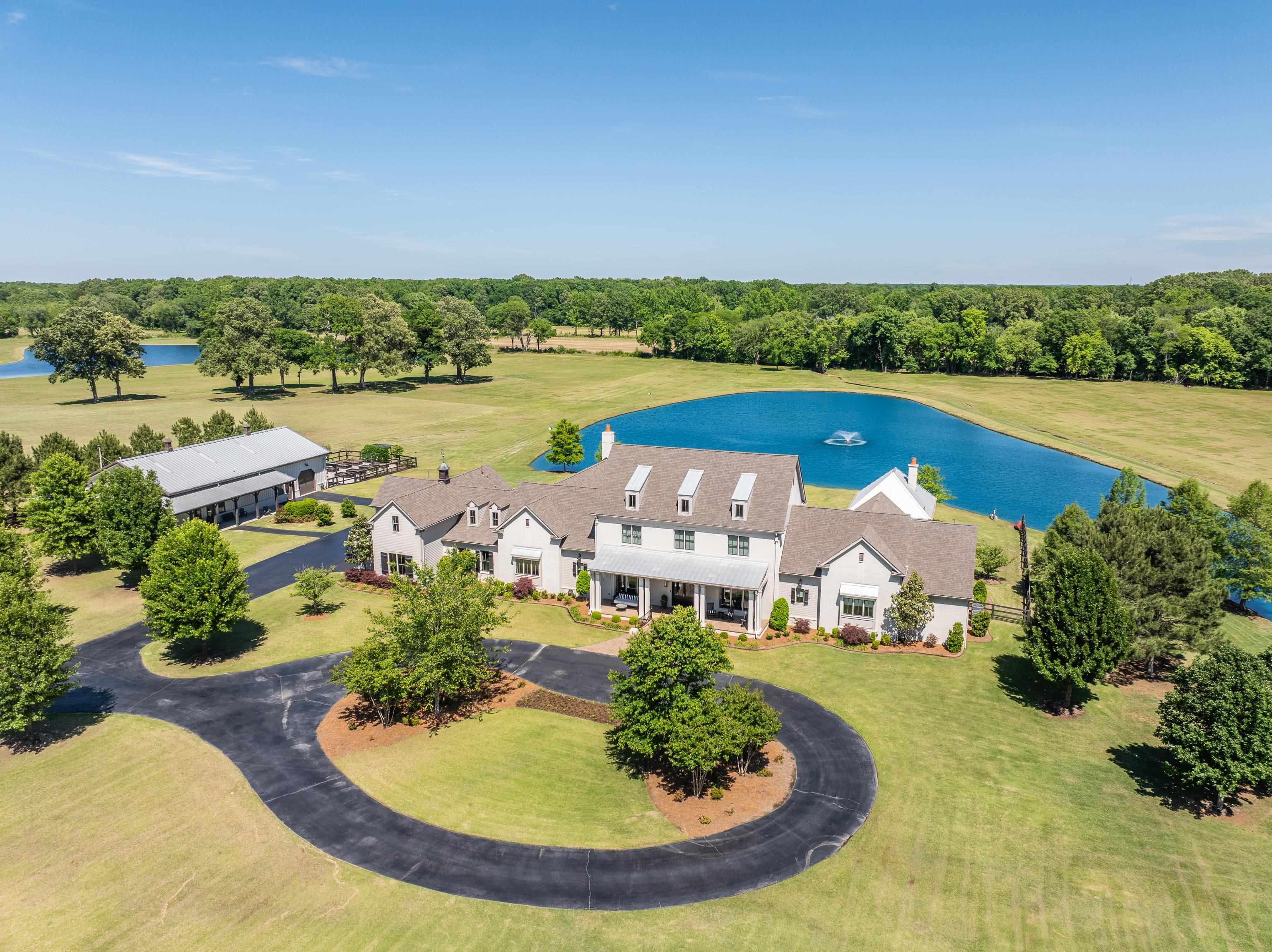 770 Ballard Road Piperton, TN 38017 - Photo 1 of 40 an aerial view of a house with outdoor space swimming pool and outdoor seating