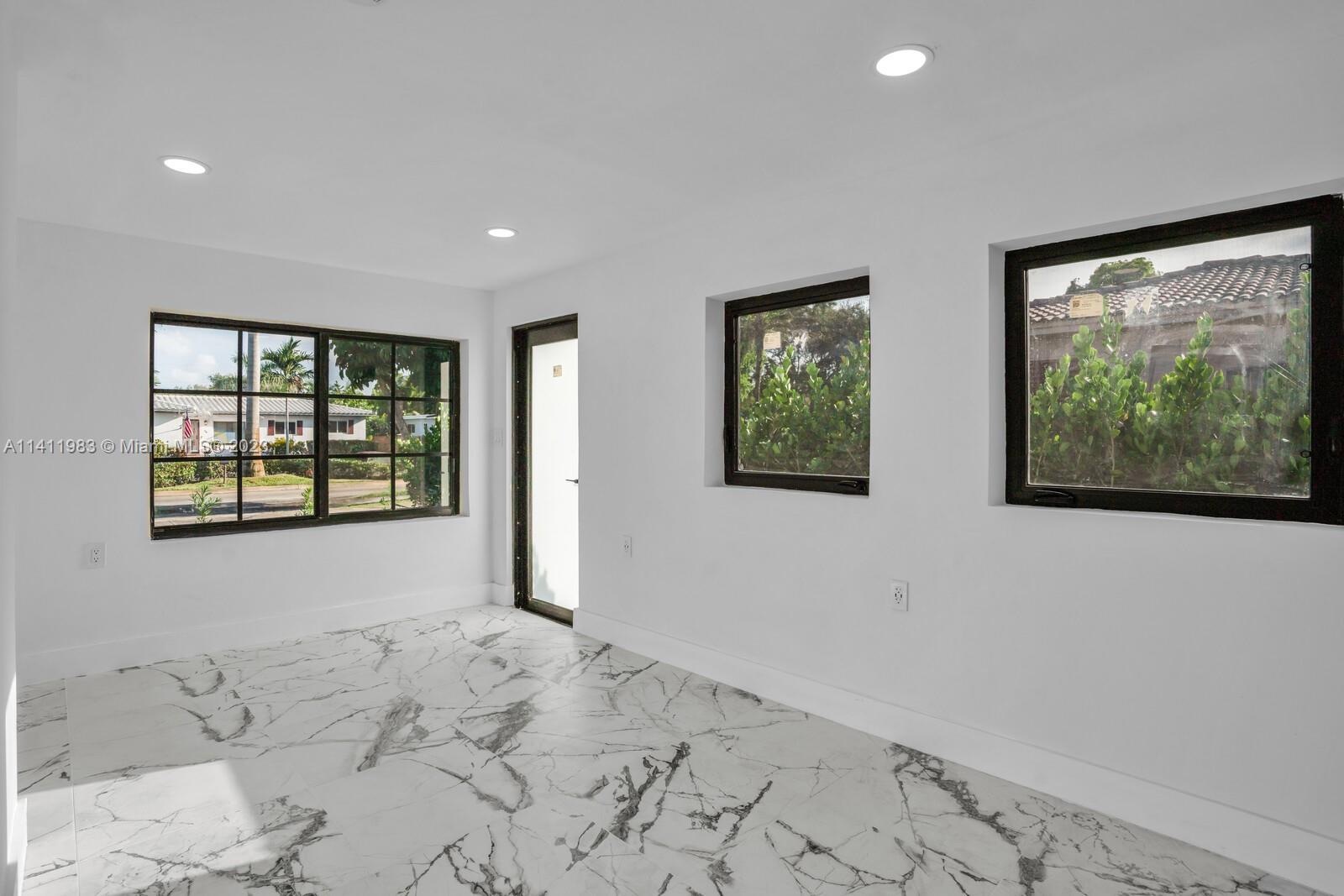 67 Northwest 109th Street Miami Shores, FL 33168 - Photo 21 of 30 Bedroom 1 with additional door leading outside