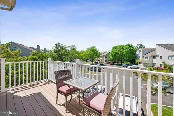 a view of a chair and table on the deck