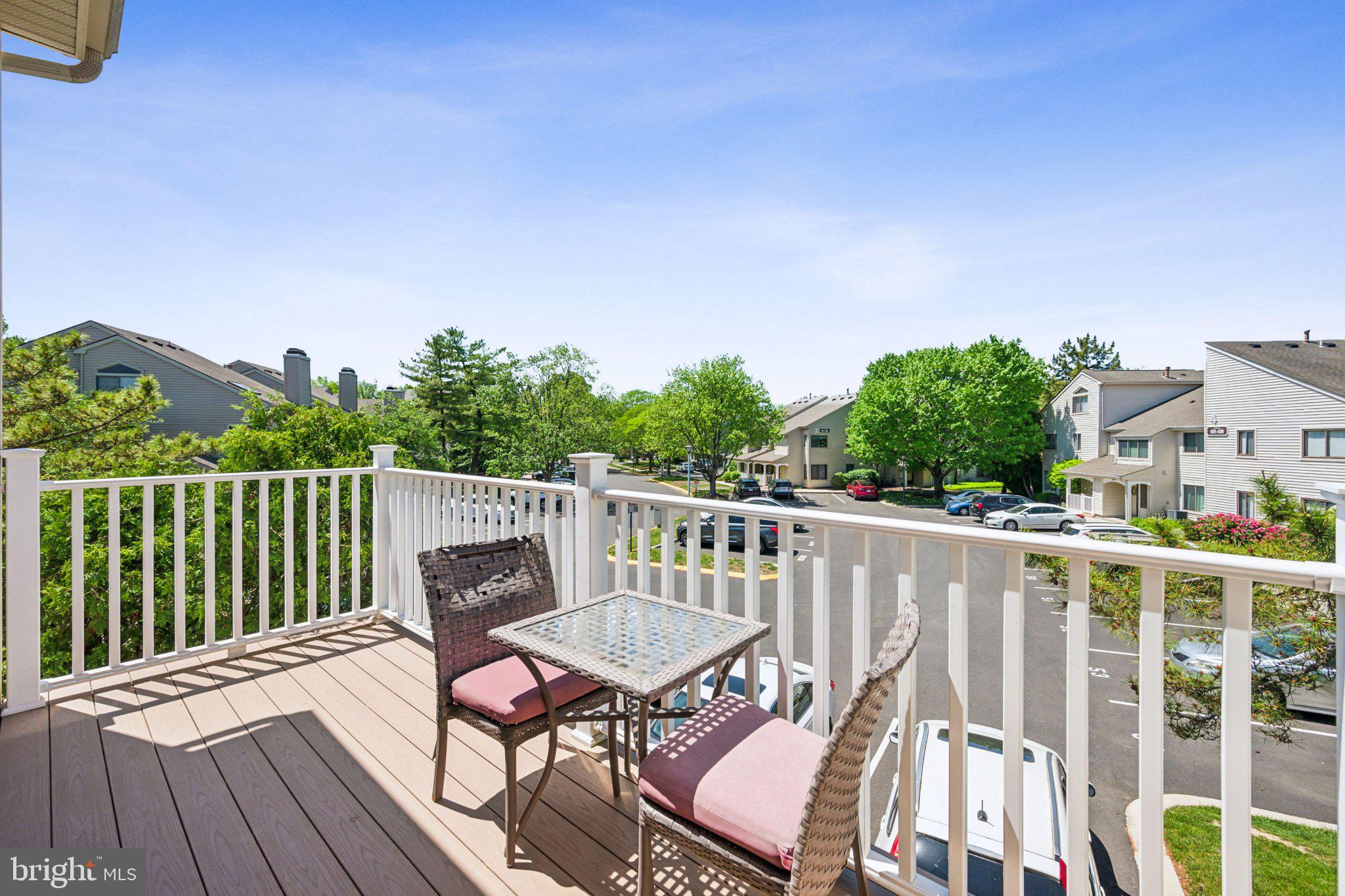 502 Gregorys Way Voorhees, NJ 08043 - Photo 2 of 13 a view of a chair and table on the deck