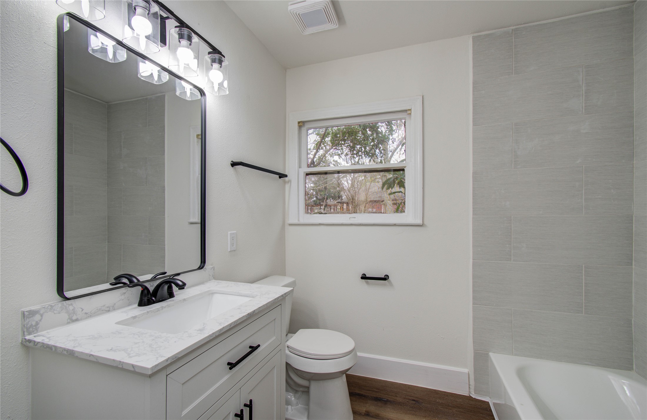 2417 Pecan Street Dickinson, TX 77539 - Photo 14 of 43 a bathroom with a sink vanity mirror and toilet