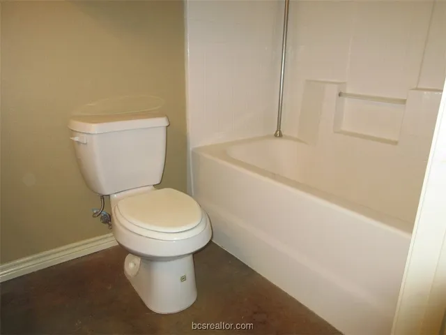 a bathroom with a toilet and a sink