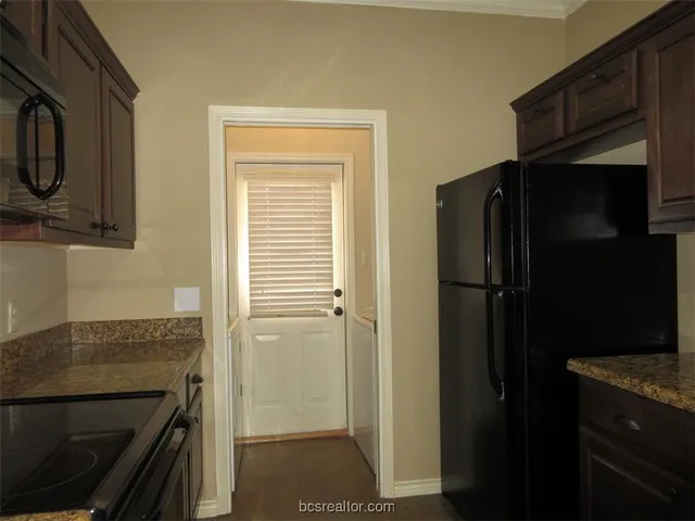 a view of a bedroom with a bathroom