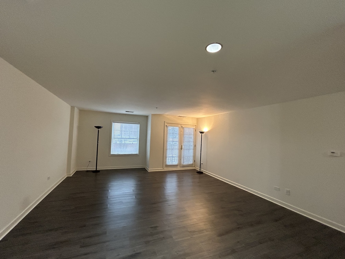 1849 Green Bay Road, Unit 2E Highland Park, IL 60035 - Photo 11 of 23 an empty room with wooden floor and windows