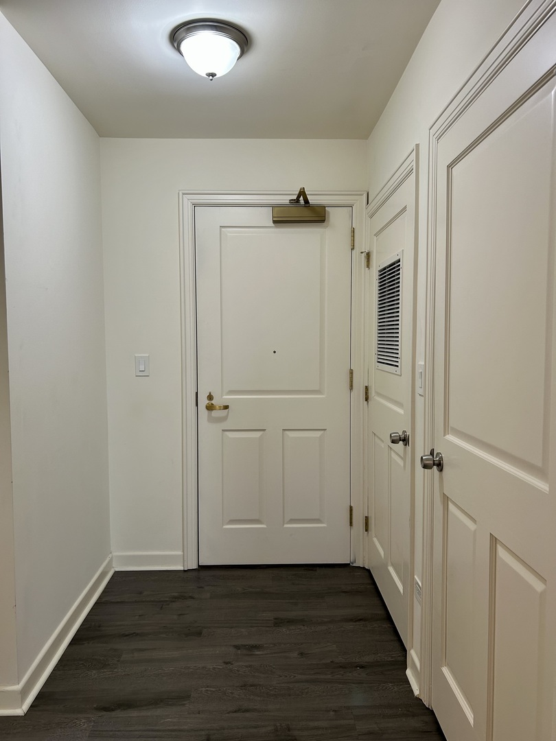 1849 Green Bay Road, Unit 2E Highland Park, IL 60035 - Photo 2 of 23 a view of a hallway with wooden floor