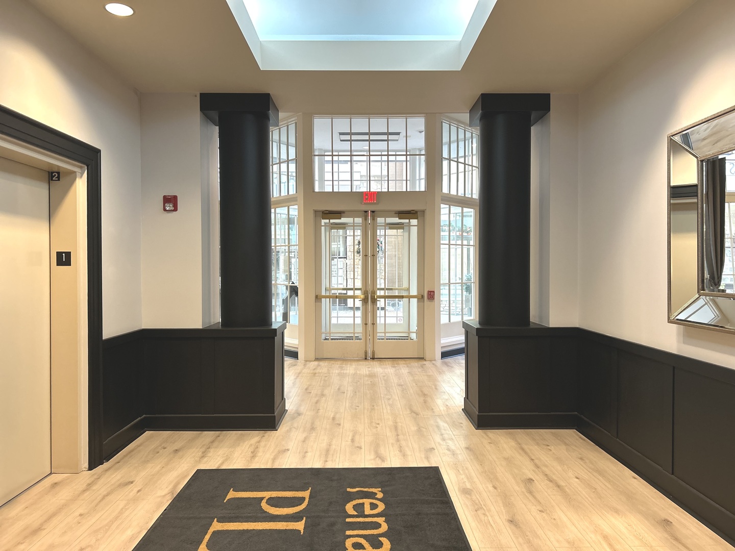 1849 Green Bay Road, Unit 2E Highland Park, IL 60035 - Photo 22 of 23 a view of an entryway of a house and a livingroom with wooden floor