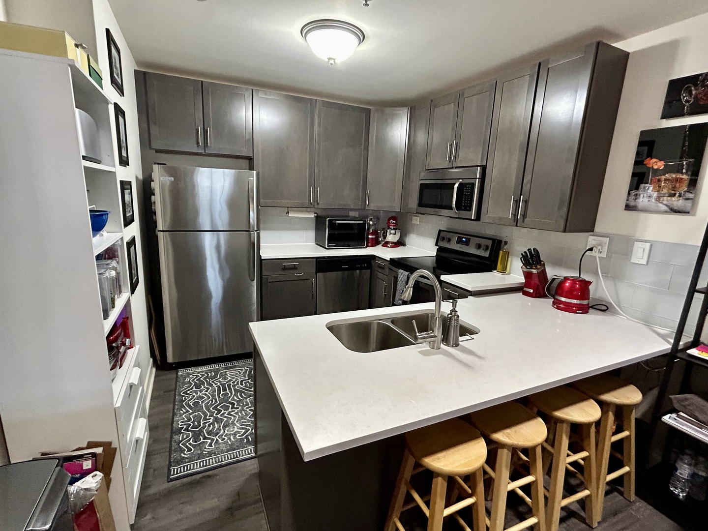1849 Green Bay Road, Unit 2E Highland Park, IL 60035 - Photo 5 of 23 a kitchen with a sink a refrigerator and cabinets
