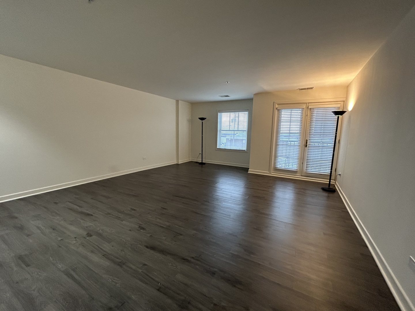 1849 Green Bay Road, Unit 2E Highland Park, IL 60035 - Photo 10 of 23 an empty room with wooden floor and windows