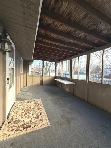 a view of an empty room with a fireplace