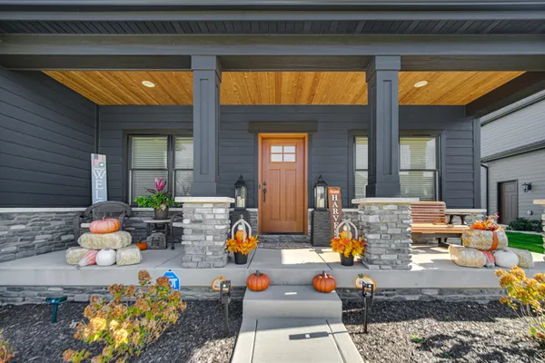 a outdoor space with the couches and dining table with the potted plant