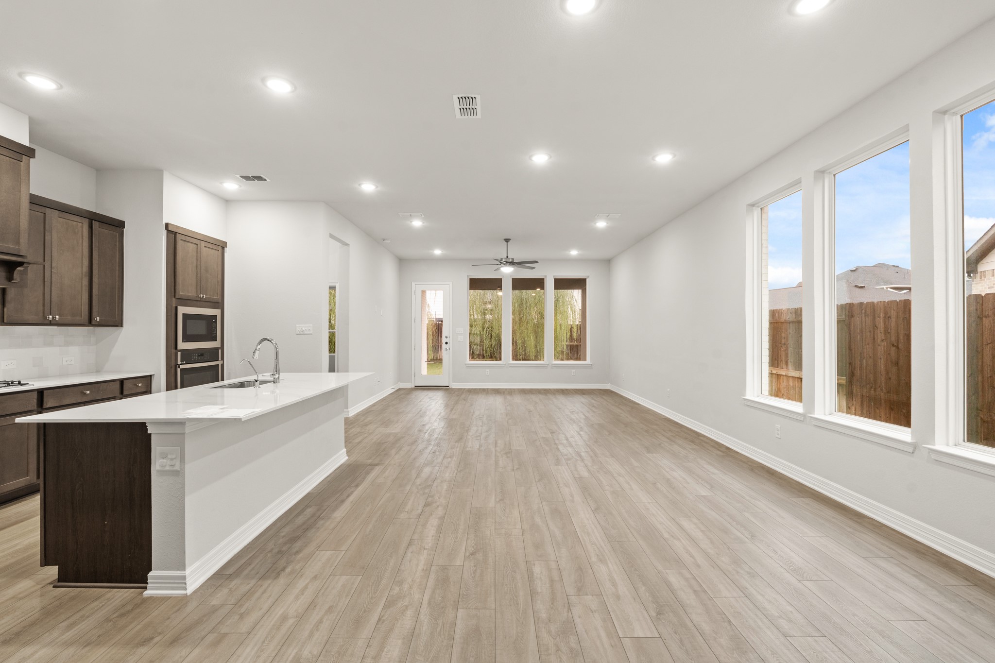4115 Chloe Ridge Lane Fulshear, TX 77441 - Photo 9 of 28 Looking into family room with kitchen on left