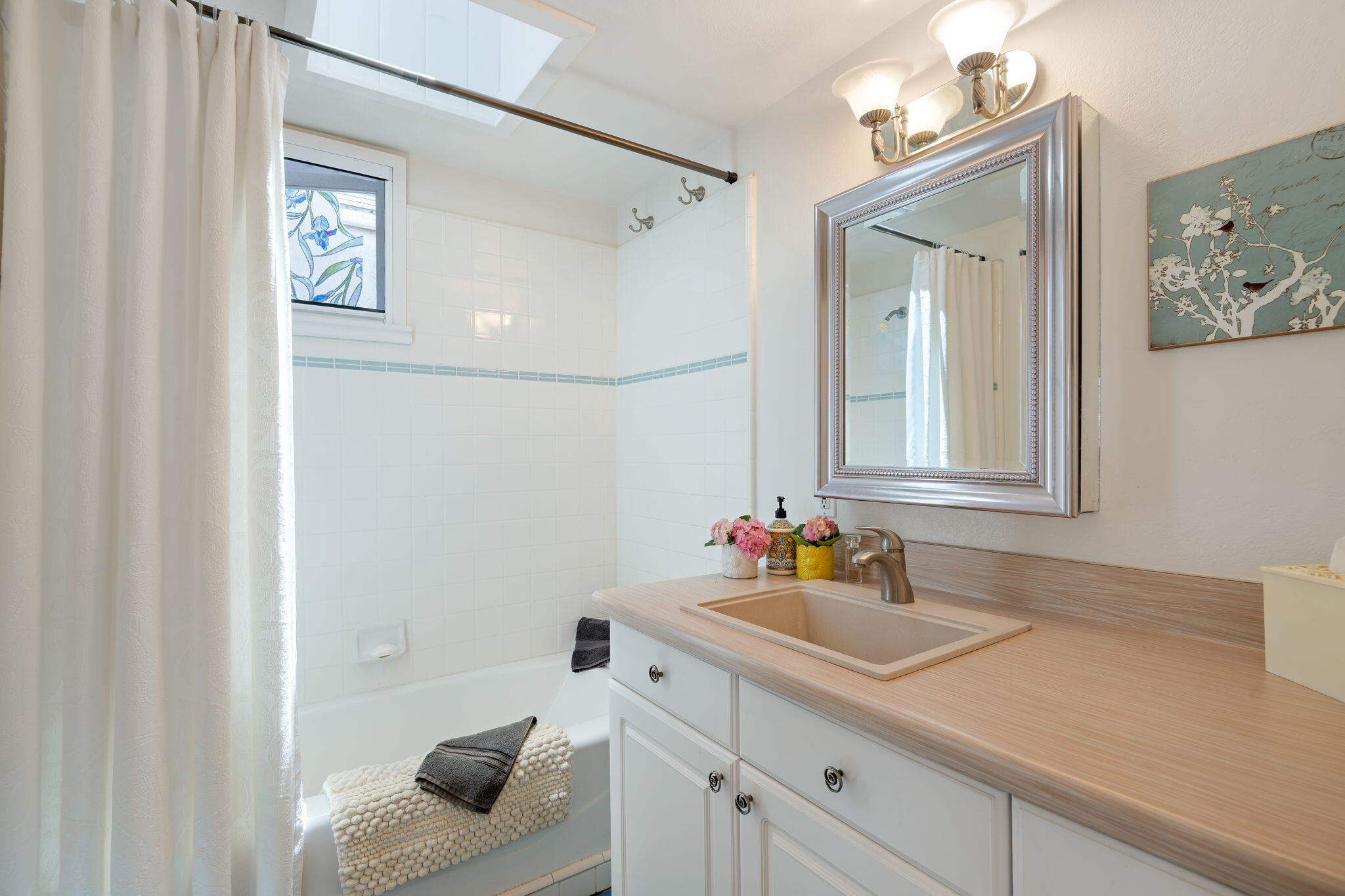 2129 Red Rose Way Santa Barbara, CA 93109 - Photo 40 of 44 a bathroom with a sink and a mirror with shower