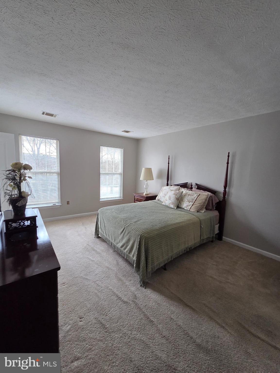 1104 Old Cannon Road Fort Washington, MD 20744 - Photo 26 of 32 a bedroom with a bed and wooden floor