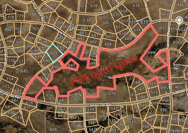 an aerial view of a building with windows and plants