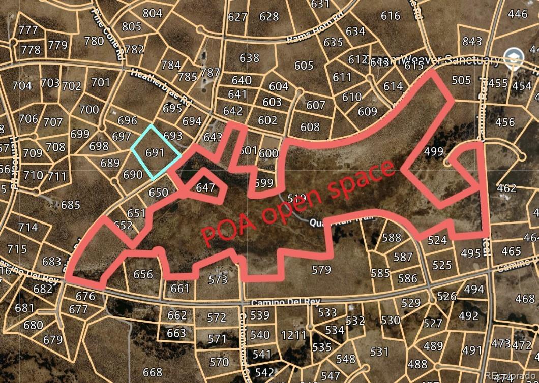 an aerial view of a building with windows and plants