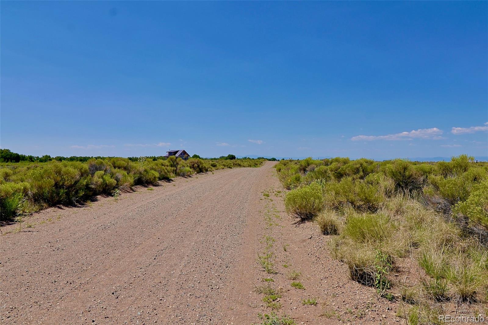 691 Birch Road Crestone, CO 81131 - Photo 14 of 16 a view of a lake with a mountain in the background