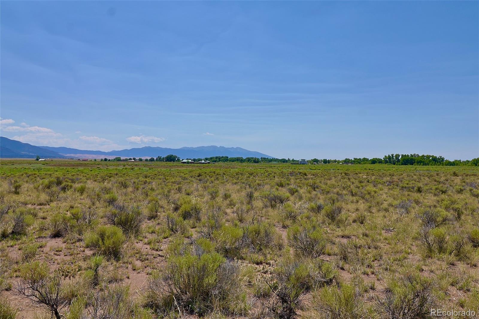 691 Birch Road Crestone, CO 81131 - Photo 6 of 16 a view of a large body of water with a building in the background