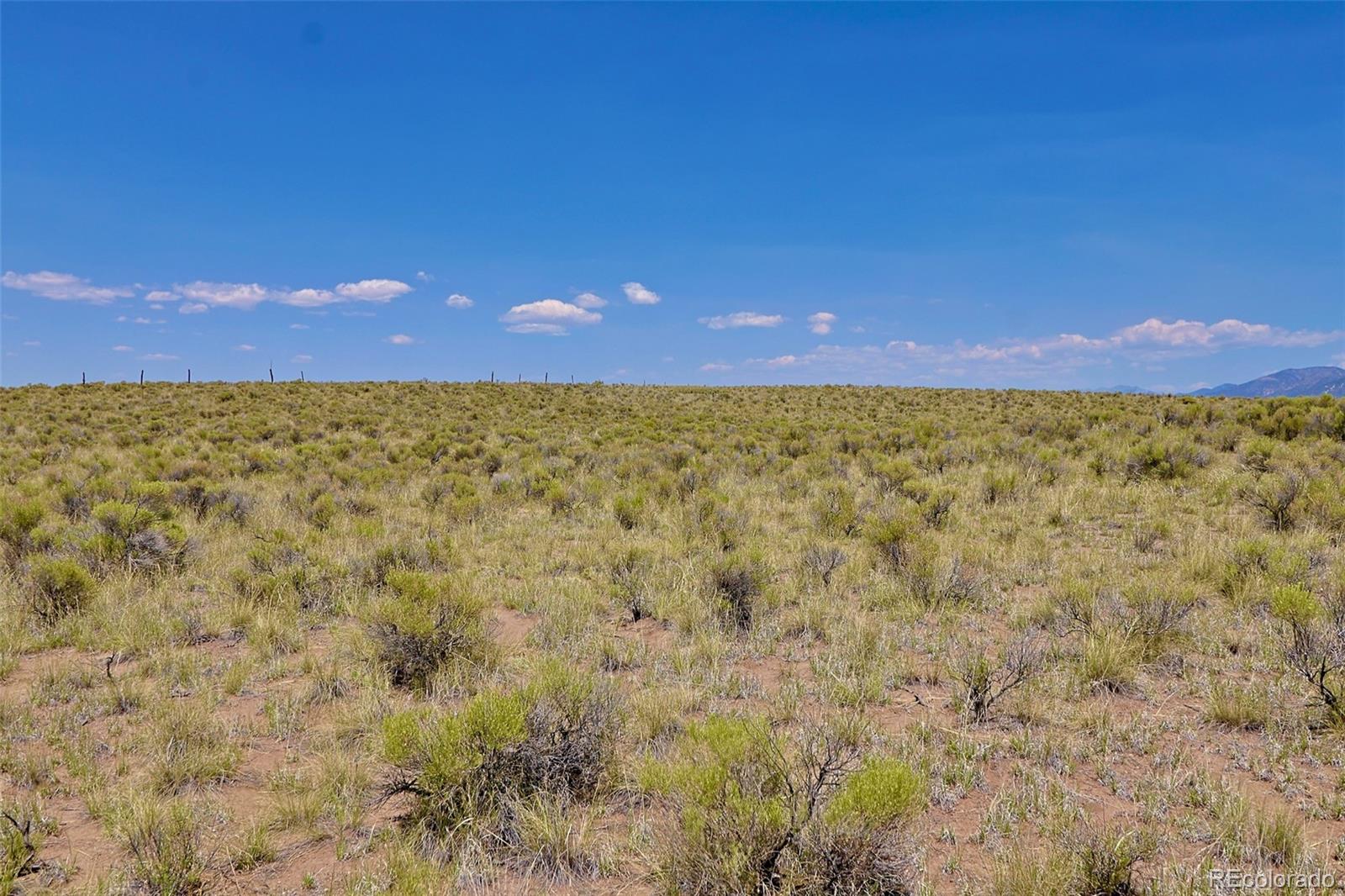 691 Birch Road Crestone, CO 81131 - Photo 10 of 16 a small yard with wooden fence