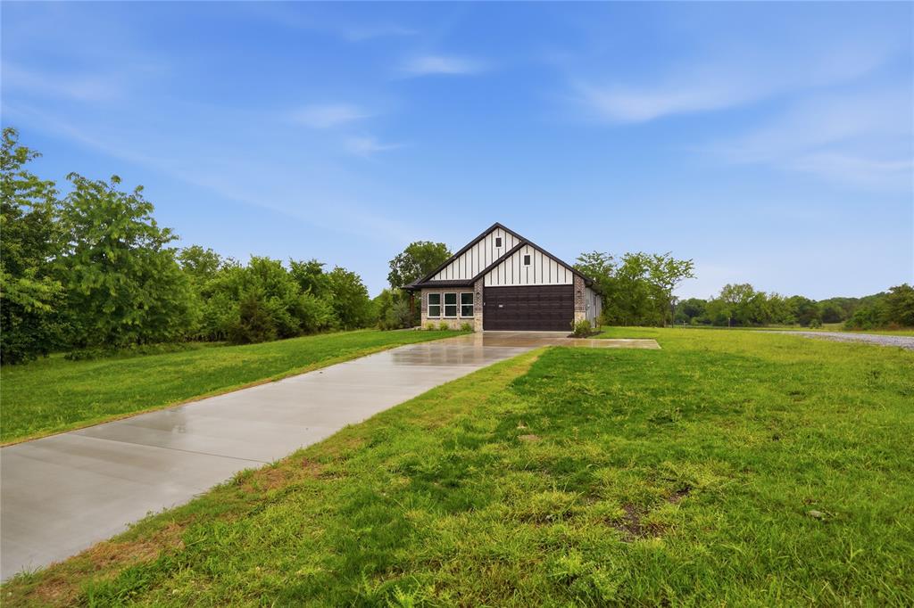 420 Ball Street Tom Bean, TX 75491 - Photo 28 of 34 a front view of a house with yard