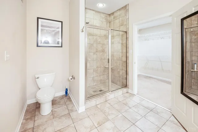 a view of balcony with wooden floor and fence
