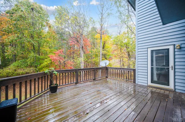 a view of a house with wooden deck