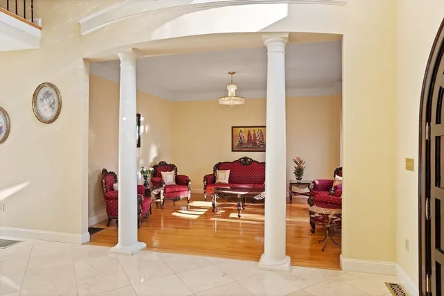 a view of living room with furniture and wooden floor