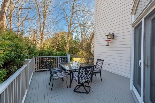 a view of a chairs and table on the balcony