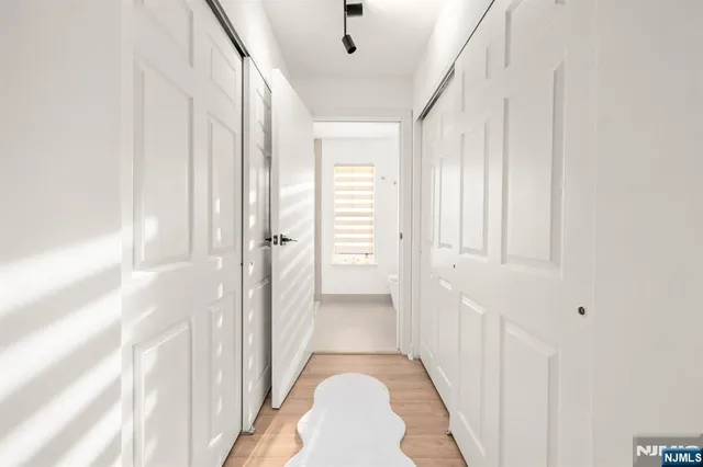 a view of a hallway with a white walls