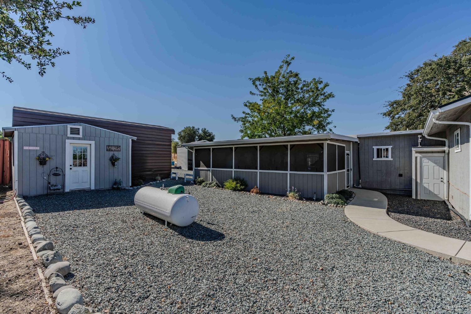 3585 South Burson Road Valley Springs, CA 95252 - Photo 15 of 99 a view of a house with backyard and sitting area