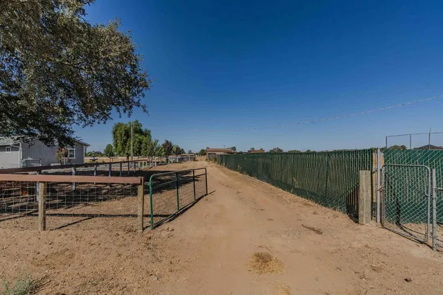a view of a dining room with furniture and a kitchen