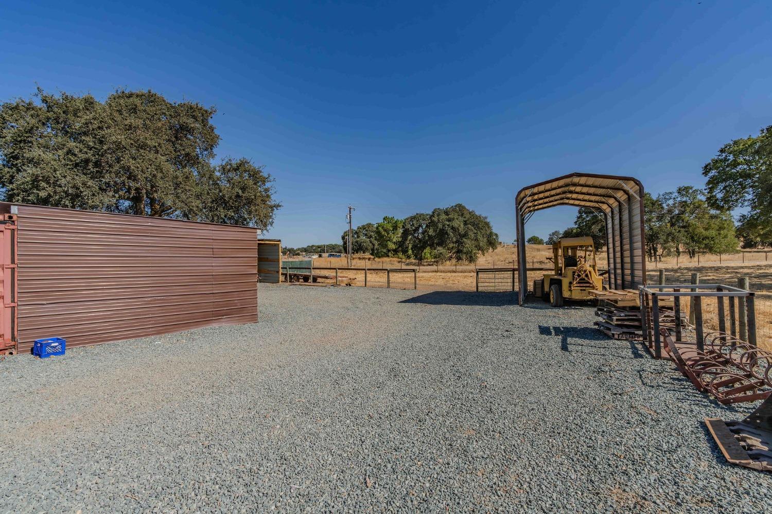 3585 South Burson Road Valley Springs, CA 95252 - Photo 31 of 99 a view of a chair and table in the backyard