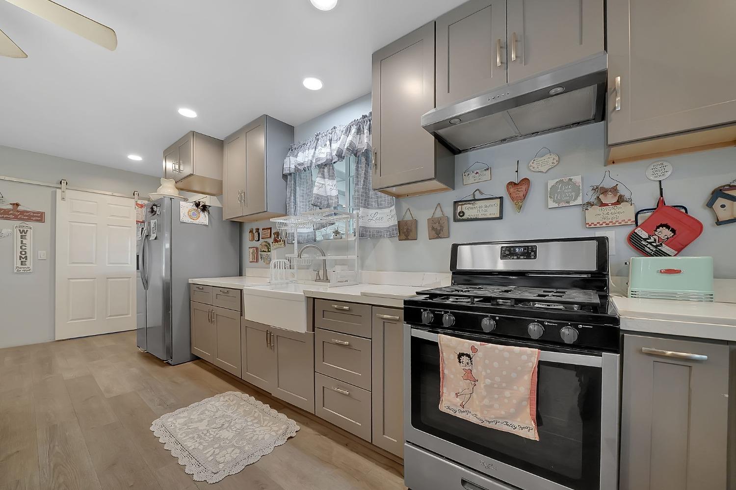 3585 South Burson Road Valley Springs, CA 95252 - Photo 53 of 99 a kitchen with stainless steel appliances granite countertop a stove and cabinets