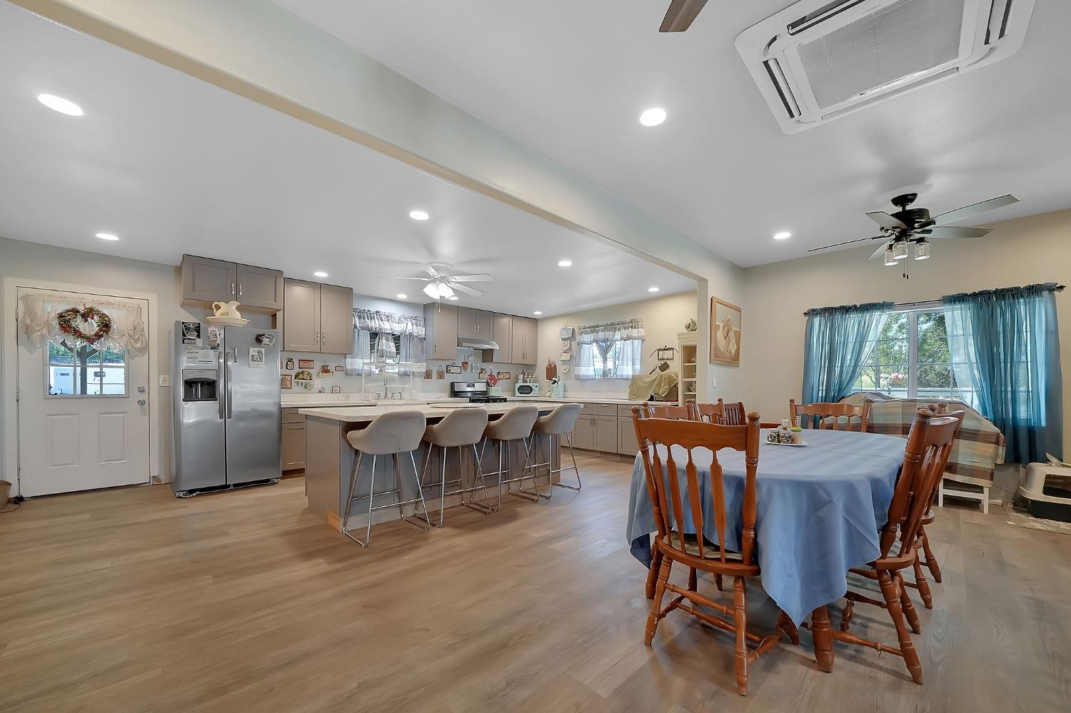 3585 South Burson Road Valley Springs, CA 95252 - Photo 59 of 99 a view of a dining room with furniture window and wooden floor
